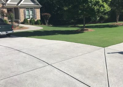 A parking area next to a front patio.
