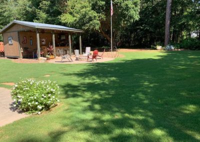 A small country house in the middle of a beautiful garden.